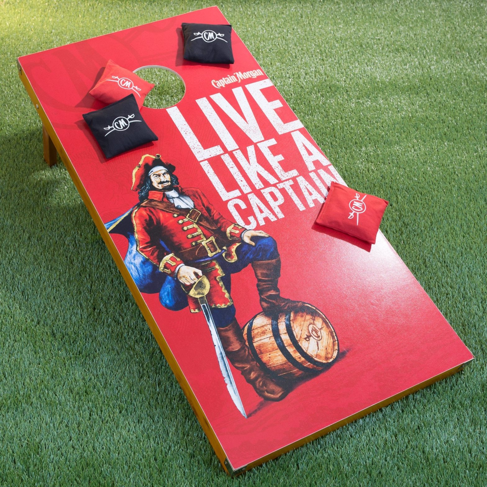 company branded corn hole game board, with matching bean bags for tossing. depicting pirate