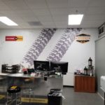 Heavy machinery tire tracks displayed on equipment rental office Wall Mural installation