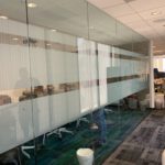 Frosted Window Vinyl With custom cut pattern installed on inside of conference room glass