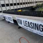 close-up view of Real Estate banners on balcony on iconic downtown San Diego high-rise