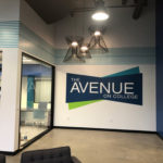 Entry Area Logo in blues and green for The Avenue on College