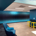 Geometric blue, teal and black diamond patterns printed in mural format