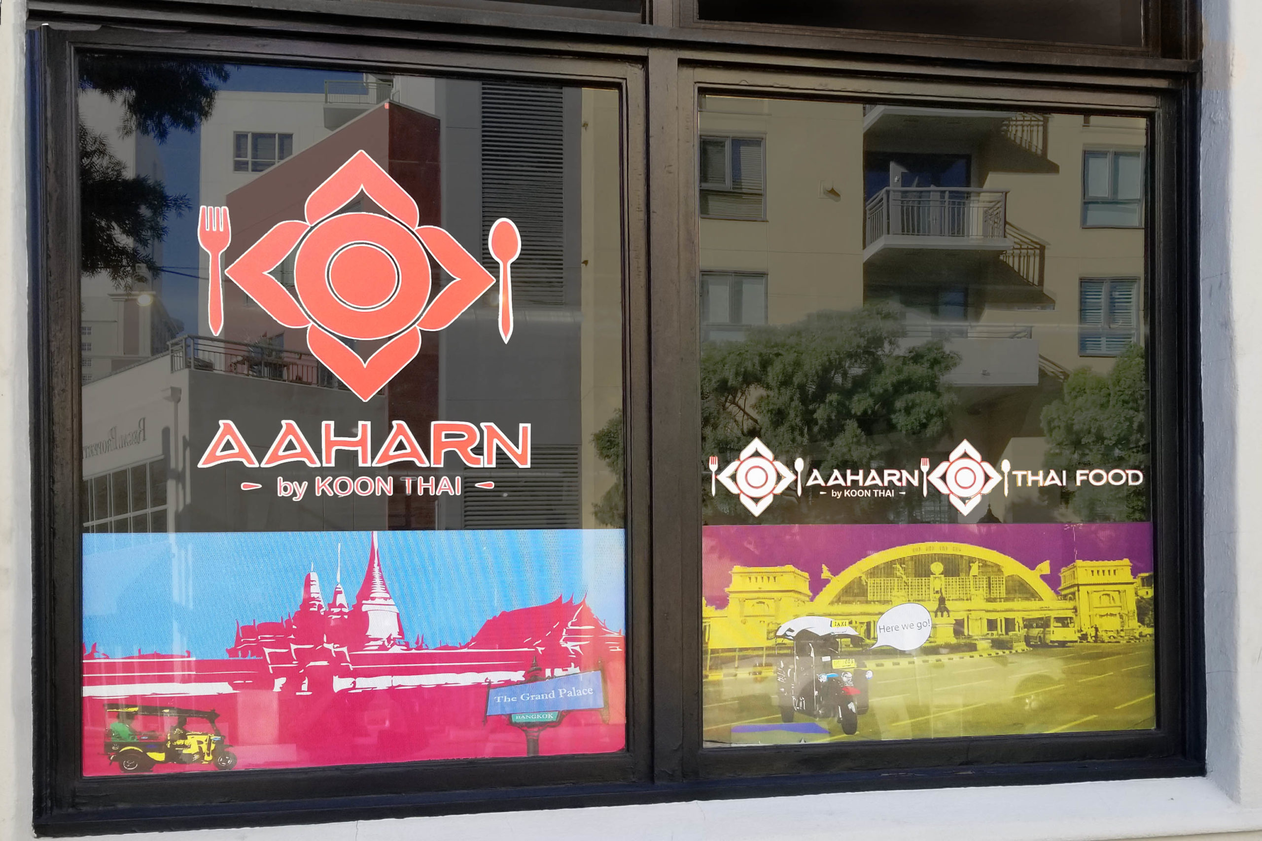 Window Clings on restaurant window printed with Aahard by Koon Thai logo and posterized images of thailand landmarks