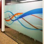 loosely interwoven wavy lines in oranges and blues printed on opaque white privacy window film