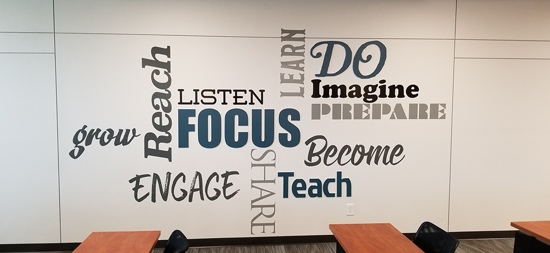 Inspirational Words Wall in black, blue, gray and tan cut vinyl letters on white wall for the VA