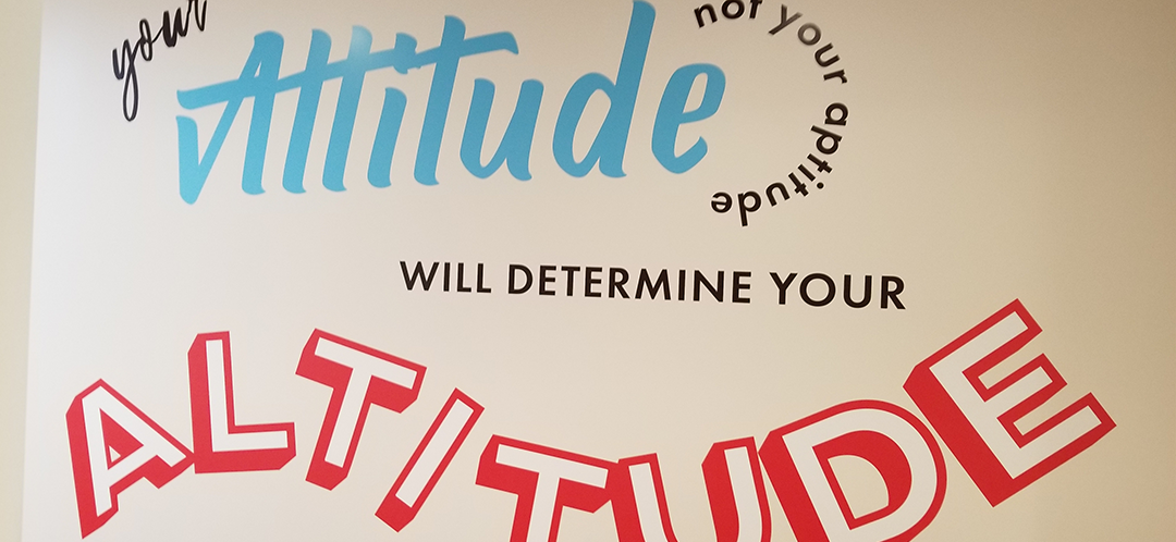 Your attitude not your aptitude will determine your altitude - wall graphic for Mission Fed credit Union