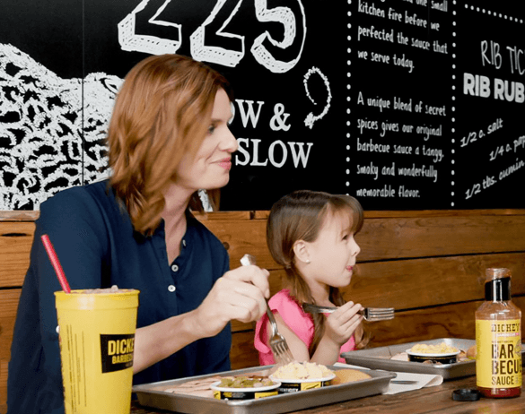 Mother and Daughter eat in restaurant with wall protected by BrandArmor+
