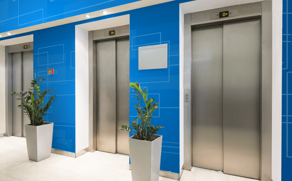 Walls near elevators are a natural place for BrandArmor+ anti-microbial film
