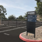 Custom Directional Signage installled in parking lot at Teradata