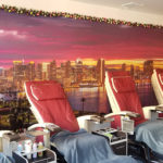 Backlit mural installed on wall at Seaport Nails and Spa