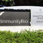 Immunity Bio identity sign and monument set in corporate landscape