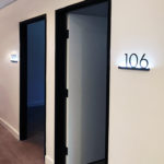 Illuminated Room Signs backlit with blue light